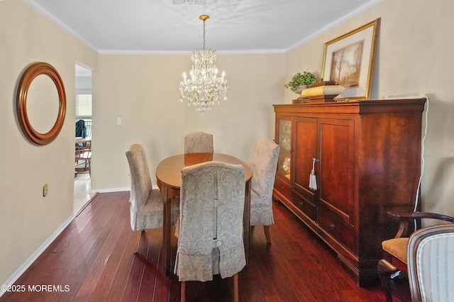 dining room featuring crown molding, an inviting chandelier, and dark hardwood / wood-style floors