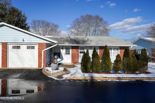 single story home featuring a garage