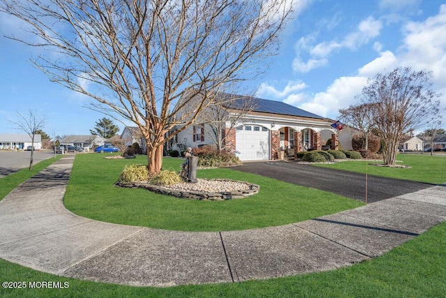 view of front facade with a front lawn and a garage