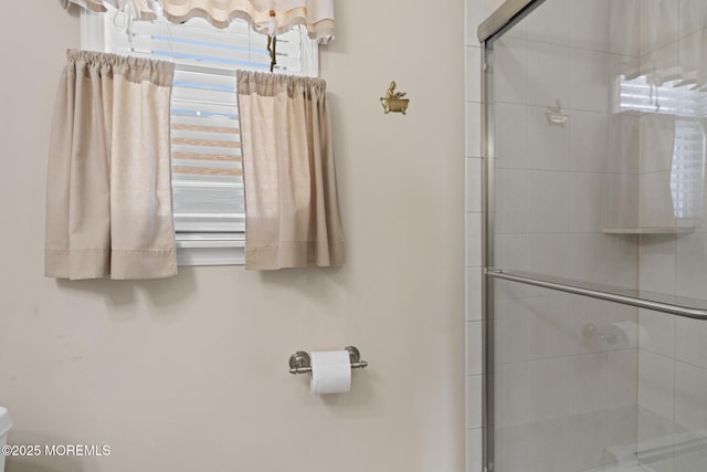 bathroom featuring an enclosed shower