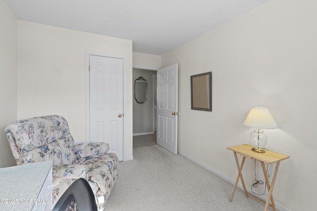 living area with light colored carpet