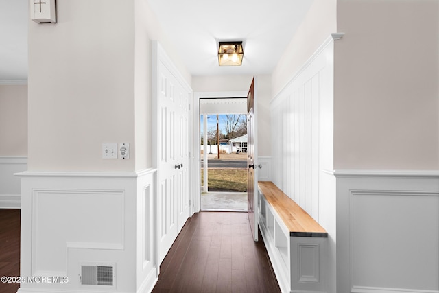 hallway with dark hardwood / wood-style flooring