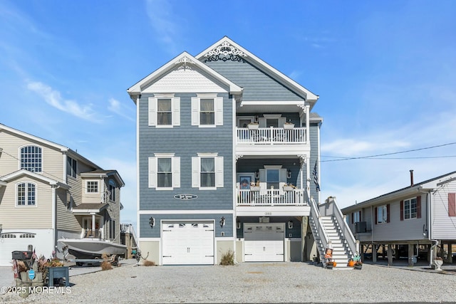 view of front of home with a balcony and a garage