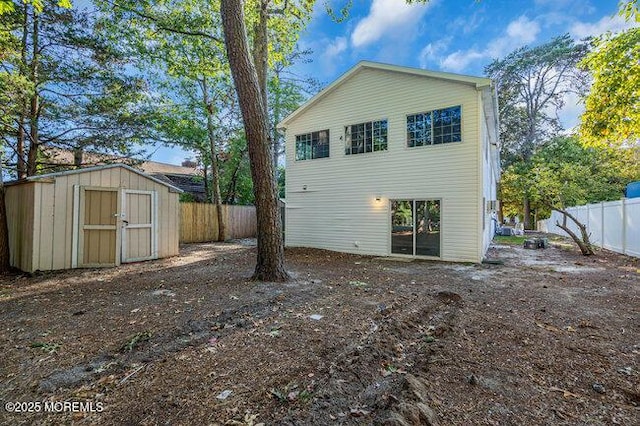 back of property featuring a storage unit