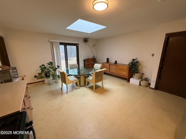 dining space with a skylight