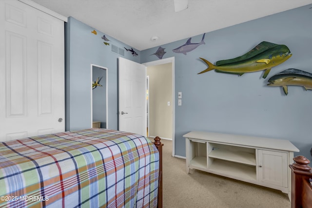 bedroom featuring light colored carpet