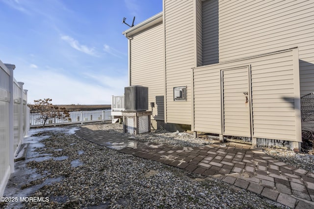 view of side of property featuring cooling unit