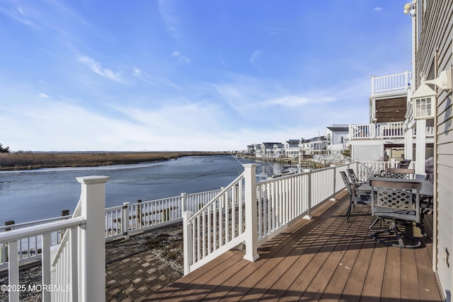 wooden terrace with a water view