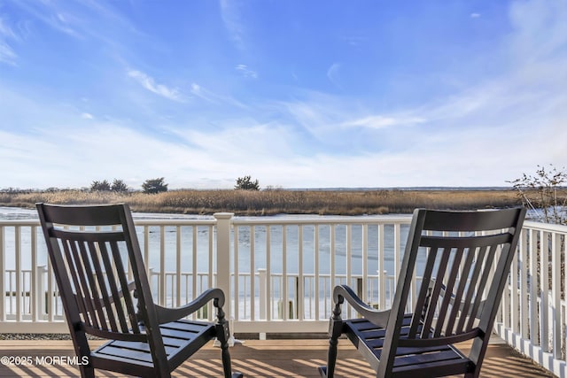 wooden terrace with a water view