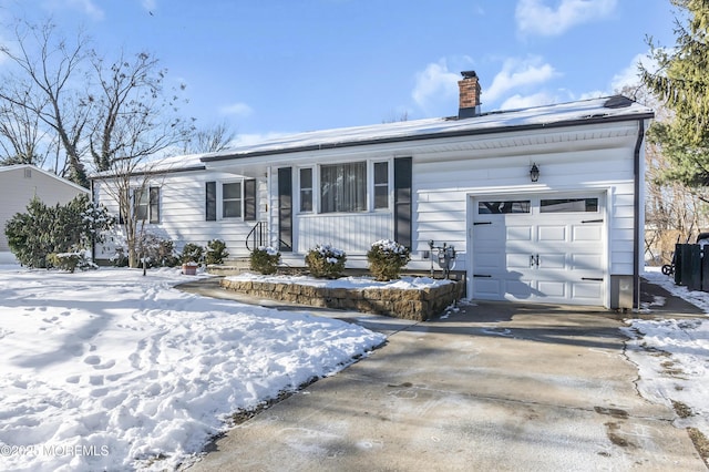 single story home featuring a garage