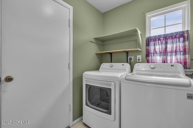 clothes washing area featuring independent washer and dryer