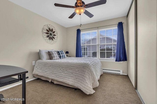 bedroom with baseboard heating, ceiling fan, and light carpet