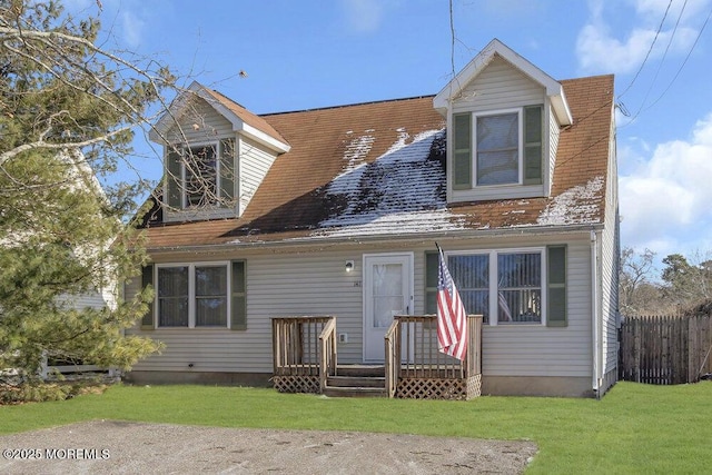 back of house featuring a lawn