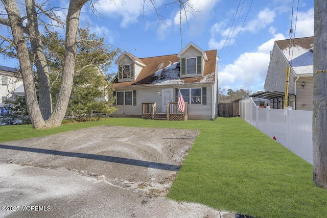 back of property featuring a carport and a yard