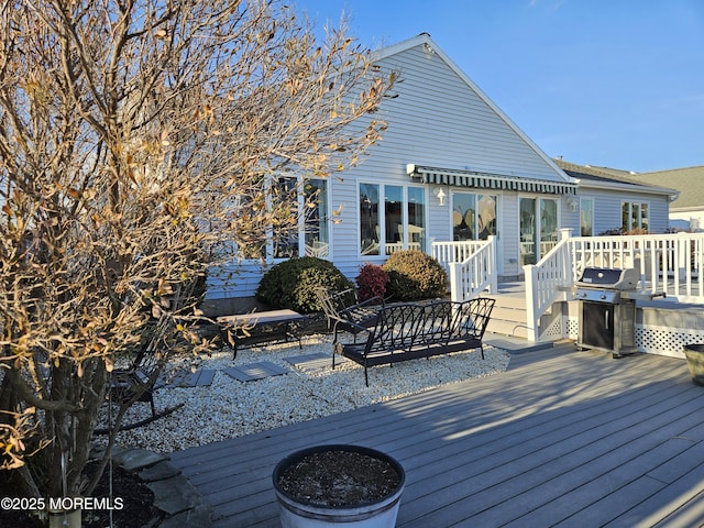 wooden deck with grilling area