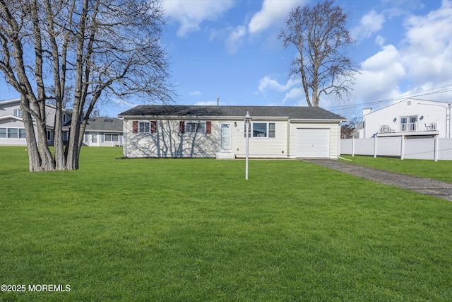 view of front of home with a garage and a front lawn