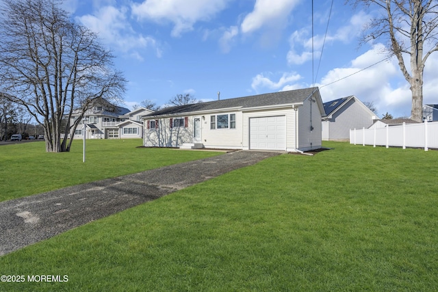 single story home with a garage and a front lawn