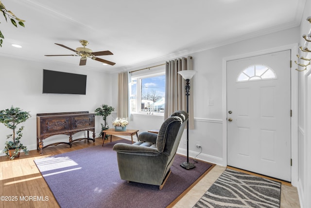 foyer with hardwood / wood-style flooring, plenty of natural light, and ornamental molding