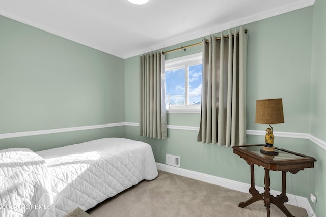 carpeted bedroom with crown molding