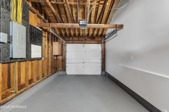 garage featuring electric panel and a garage door opener