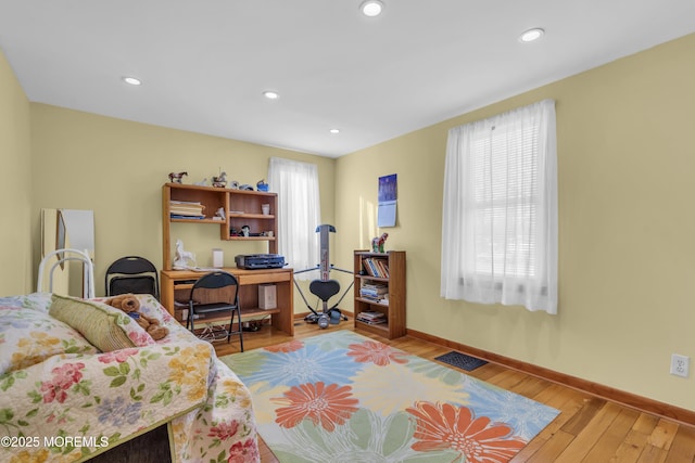 interior space featuring a healthy amount of sunlight and hardwood / wood-style floors