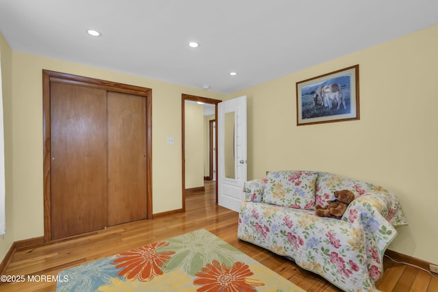 sitting room featuring light hardwood / wood-style flooring