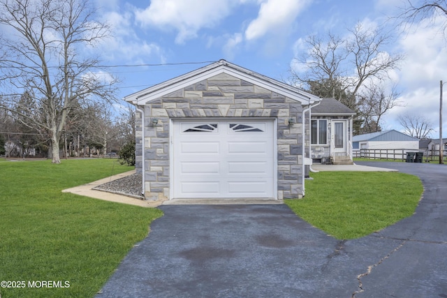 view of front of house with a garage and a front lawn