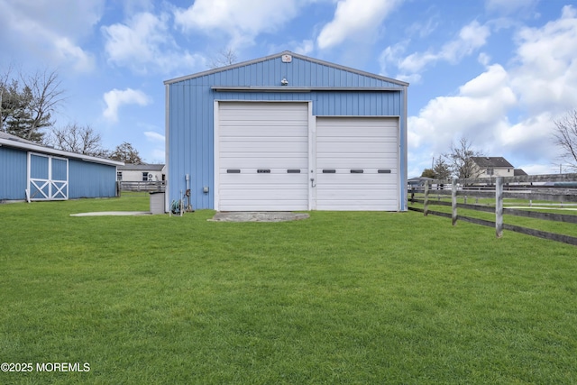 garage with a yard