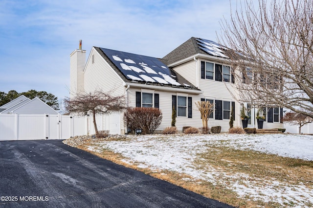 view of front facade with solar panels