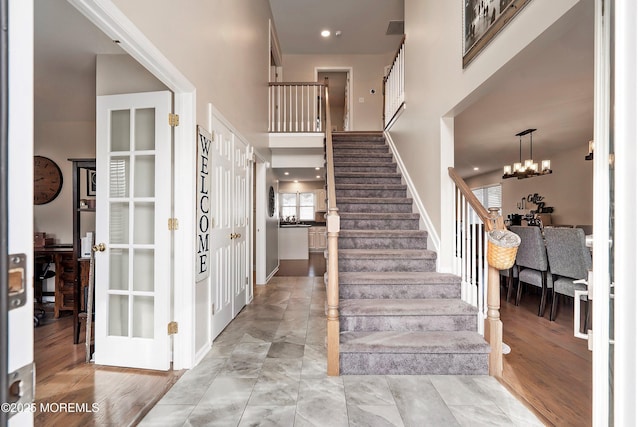 foyer featuring a notable chandelier