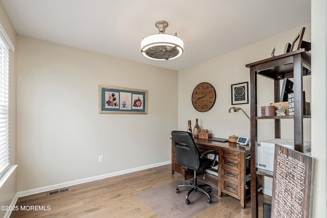 home office with light wood-type flooring