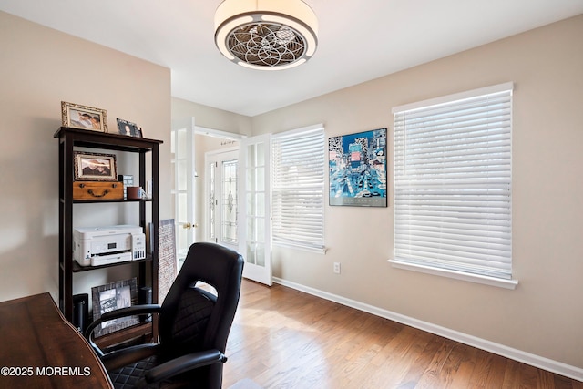 office area featuring light hardwood / wood-style flooring and french doors