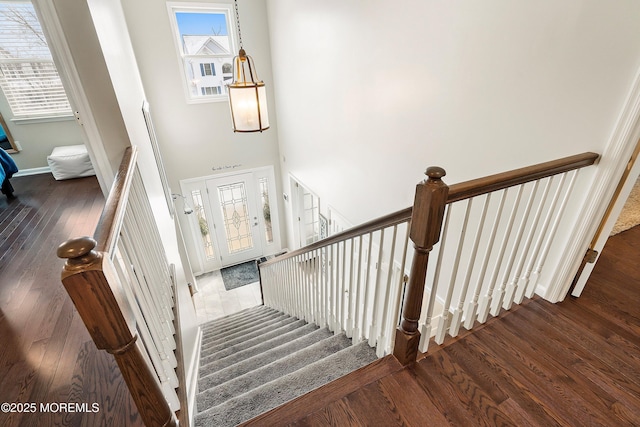 staircase featuring hardwood / wood-style floors