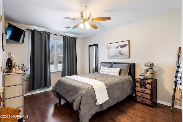 bedroom with ceiling fan and dark hardwood / wood-style flooring