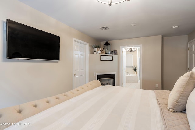 bedroom featuring ensuite bathroom