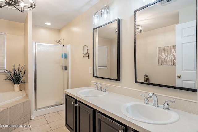 bathroom featuring tile patterned floors, vanity, and independent shower and bath