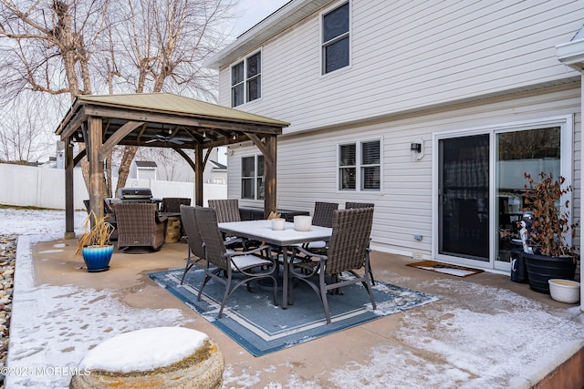 snow covered patio with a gazebo