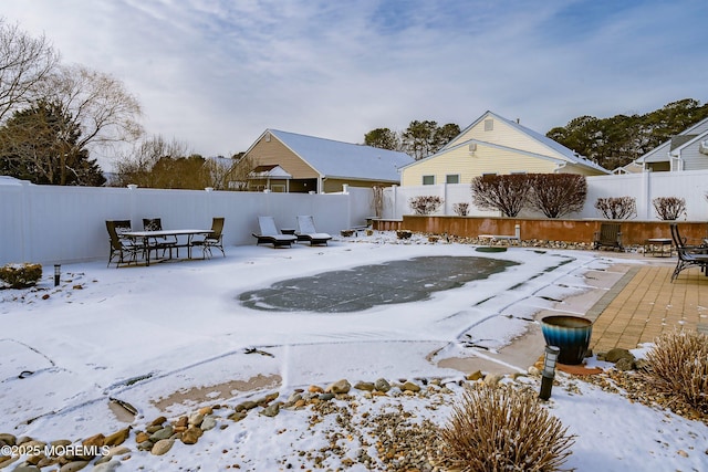 view of snow covered property