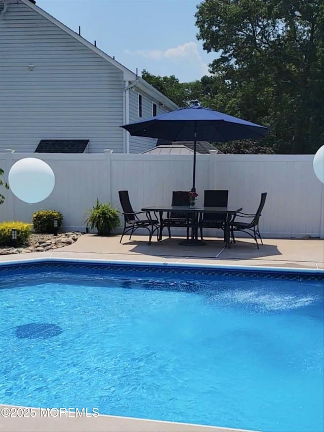 view of pool featuring a patio area