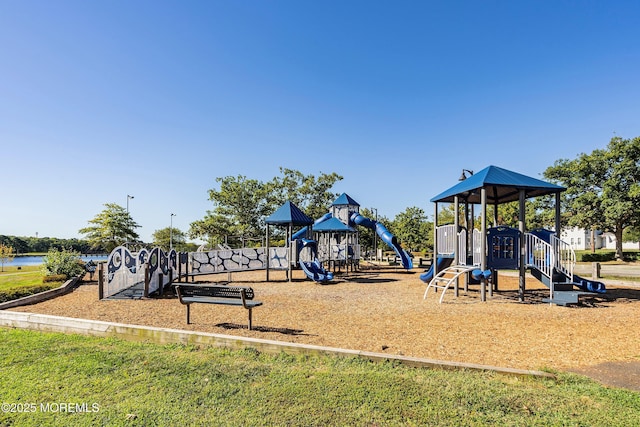 view of jungle gym with a water view