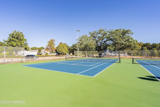 view of sport court featuring basketball hoop