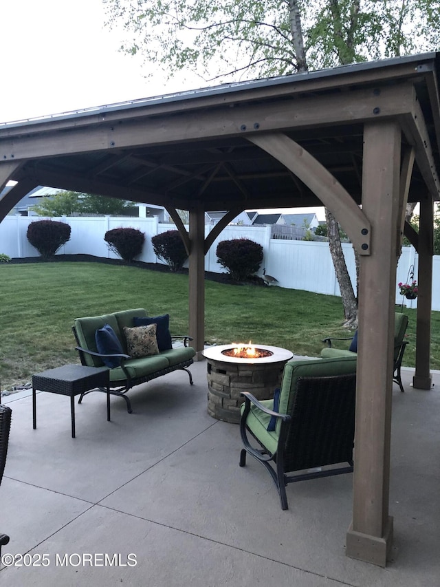 view of patio / terrace featuring an outdoor fire pit and a gazebo