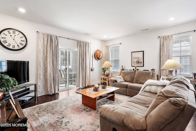 living room featuring dark wood-type flooring