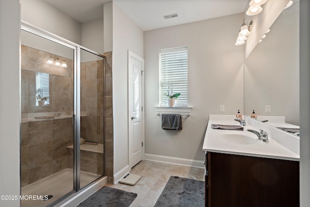 bathroom featuring an enclosed shower and vanity