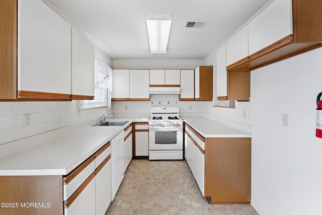 kitchen featuring white cabinetry, sink, white appliances, and a textured ceiling