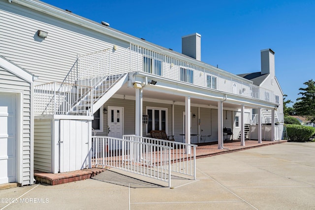 rear view of house featuring a patio