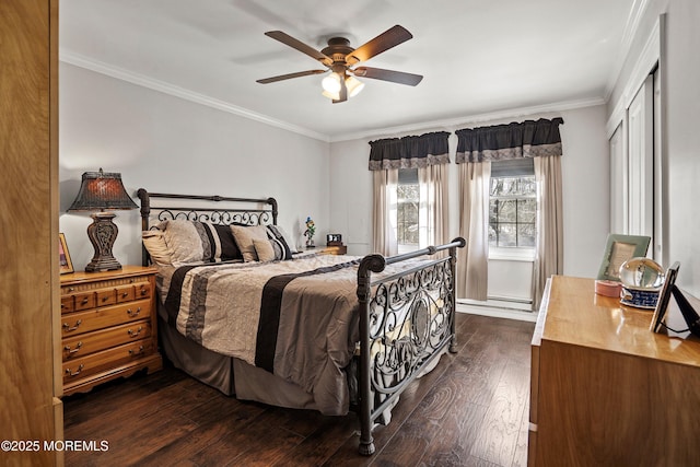 bedroom with ornamental molding, dark wood-type flooring, and ceiling fan