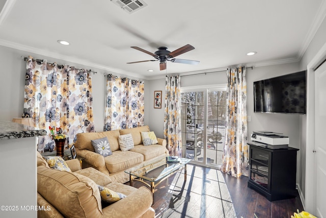 living room with crown molding, dark wood-type flooring, and ceiling fan