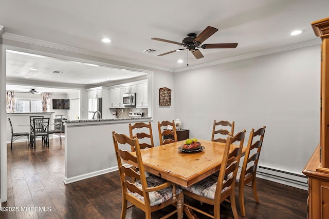 dining room featuring crown molding, ceiling fan, dark hardwood / wood-style floors, and baseboard heating