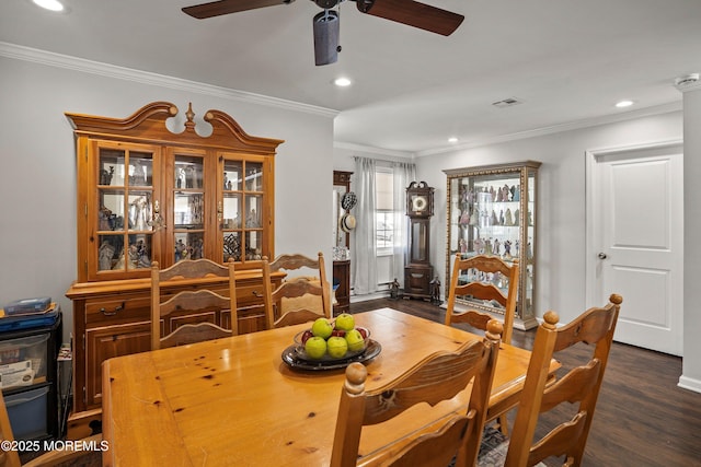 dining room featuring crown molding, dark hardwood / wood-style floors, and ceiling fan